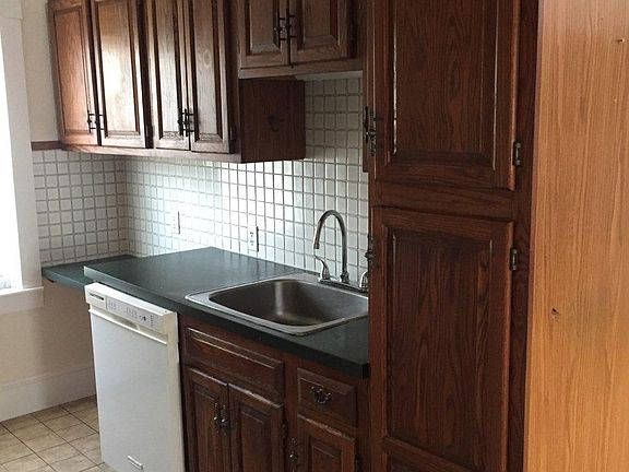 Kitchen sink and cabinets, lots of cabinets.
