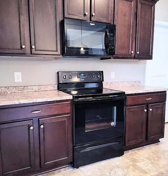 Smooth top stove and built in microwave.