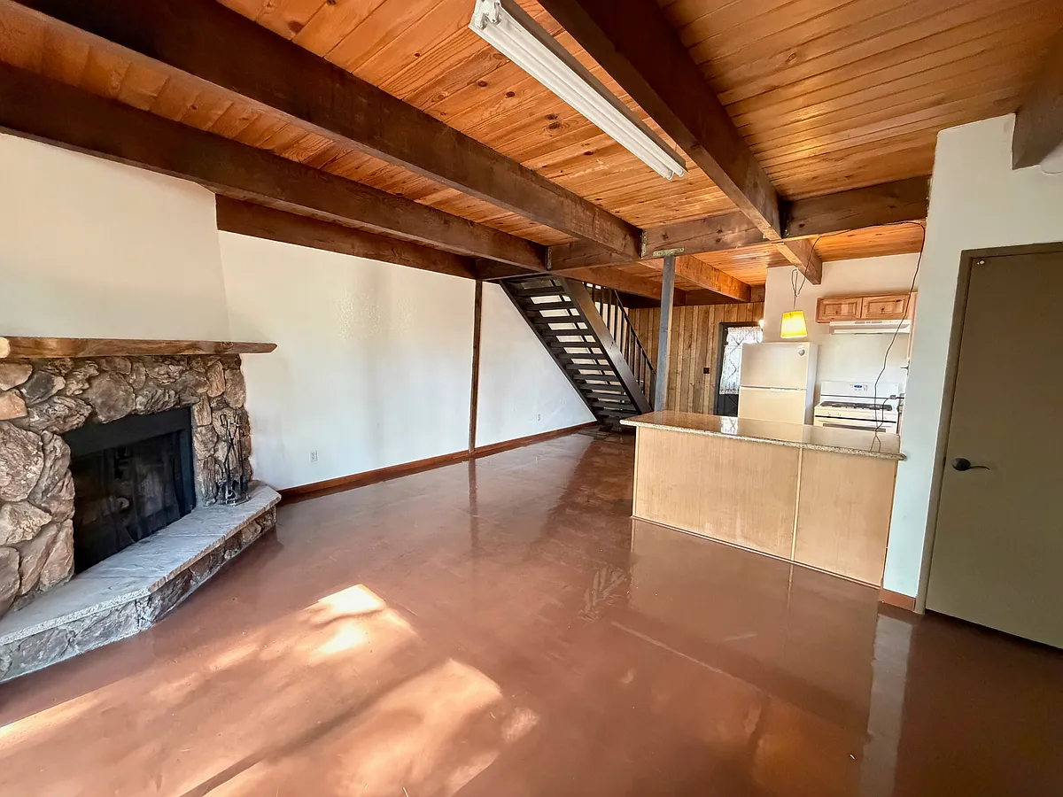 Living room open to kitchen with eat at bar. - 31691 Panorama Dr