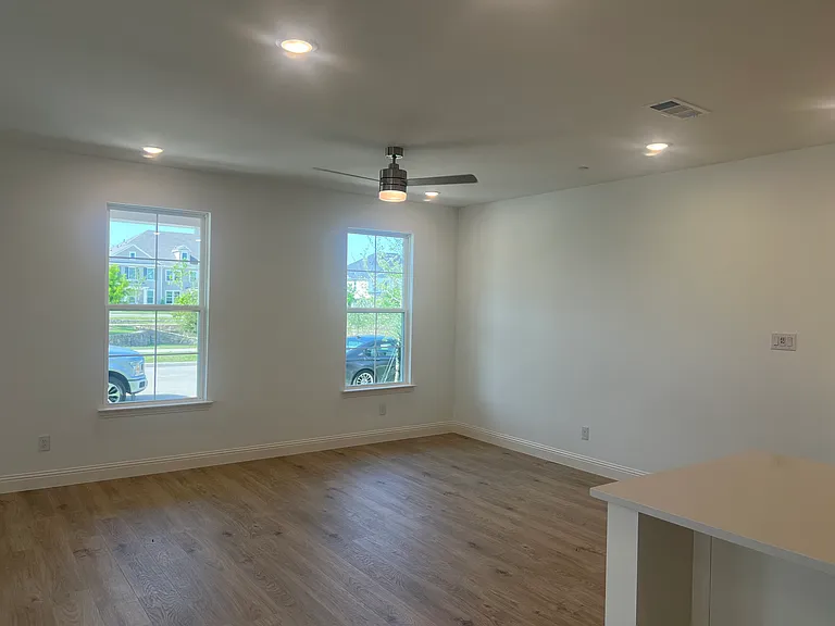 Living room with ceiling fan.
