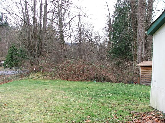 Large Partially Fenced Yard with Shed