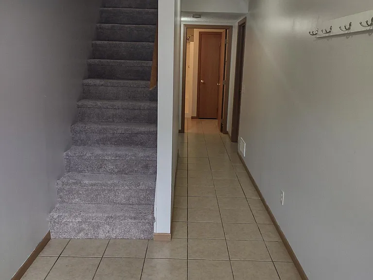Standing just inside entrance