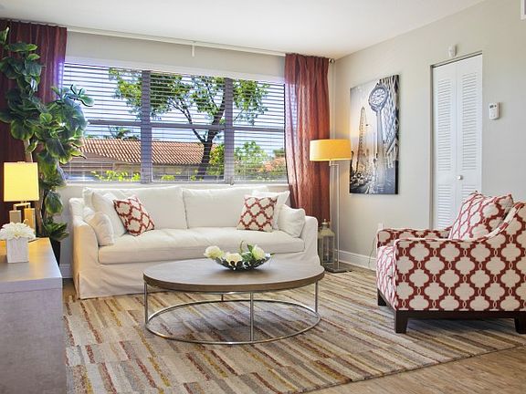 Spacious living room with views of community landscape.