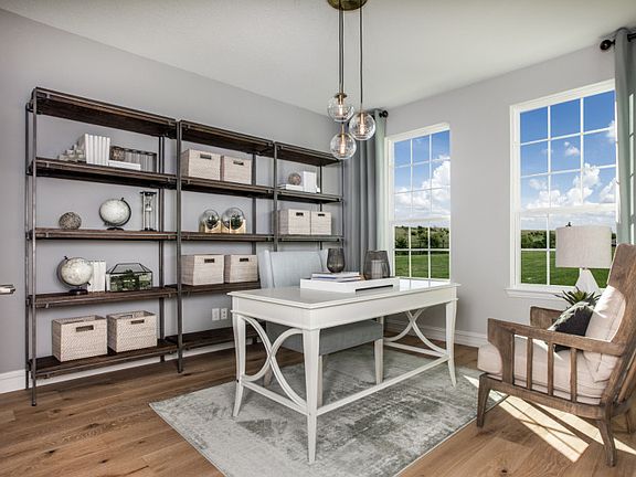 Study with large windows and French door entry model representation