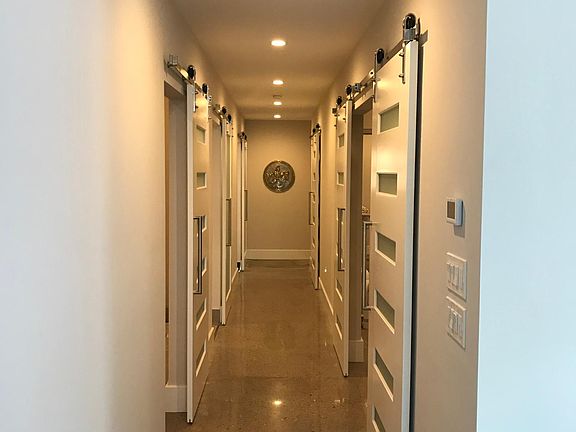 Main hallway leading to bedrooms, bathrooms and laundry
