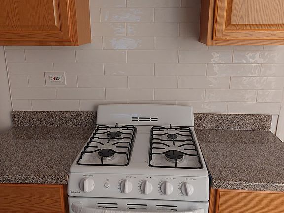 new kitchen cabinets, countertops, new stove.