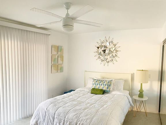 Bedroom #2: Queen size bed, dresser and large closet. Sliding doors leading out to pool and spa.