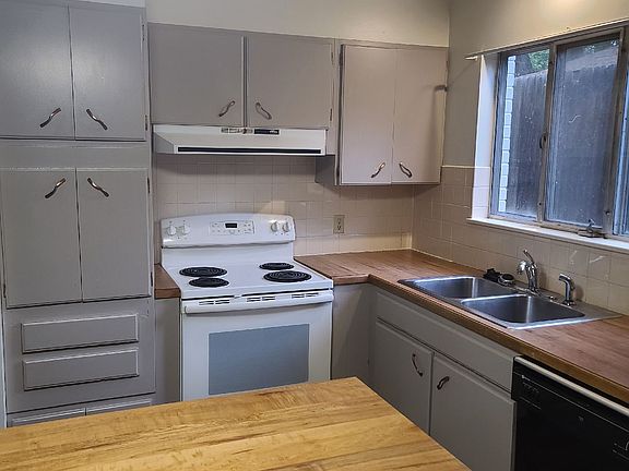 Modern kitchen with dishwasher and lots of counter space.