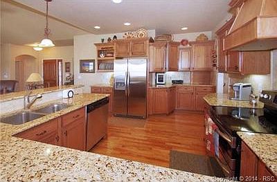 Amazing kitchen with wood floors and granite counters
