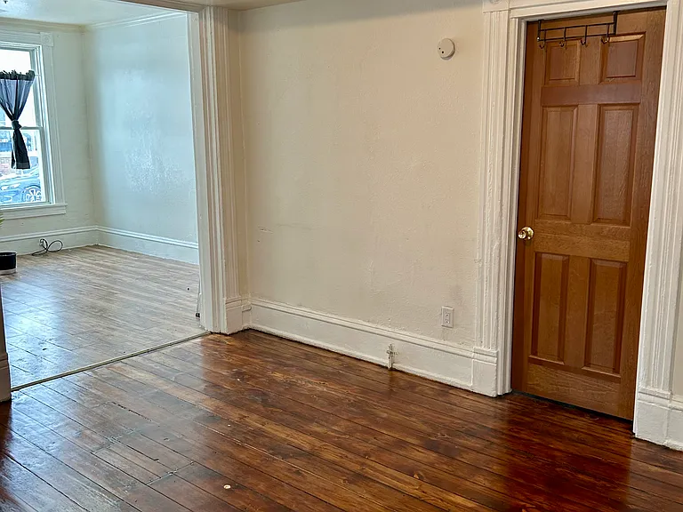 Living Room, view to front room, door to front bedroom