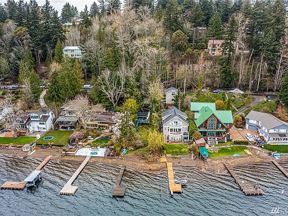 The 1945 cabin is flanked by luxury homes as the proximity to major employers like Microsoft, Amazon, Facebook has made Rosemont a coveted spot on Lake Sammamish