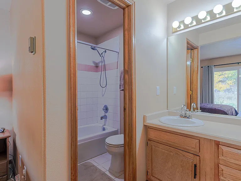 First floor bedroom with private vanity and bathroom