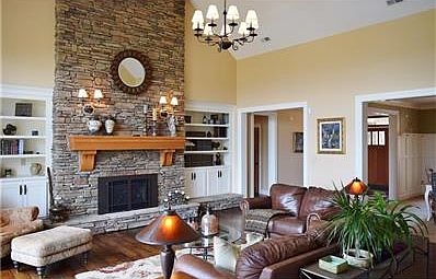 Built-in book shelves, high end lighting, large mantel, gas log fireplace.....all the details add to the comfort of this home.