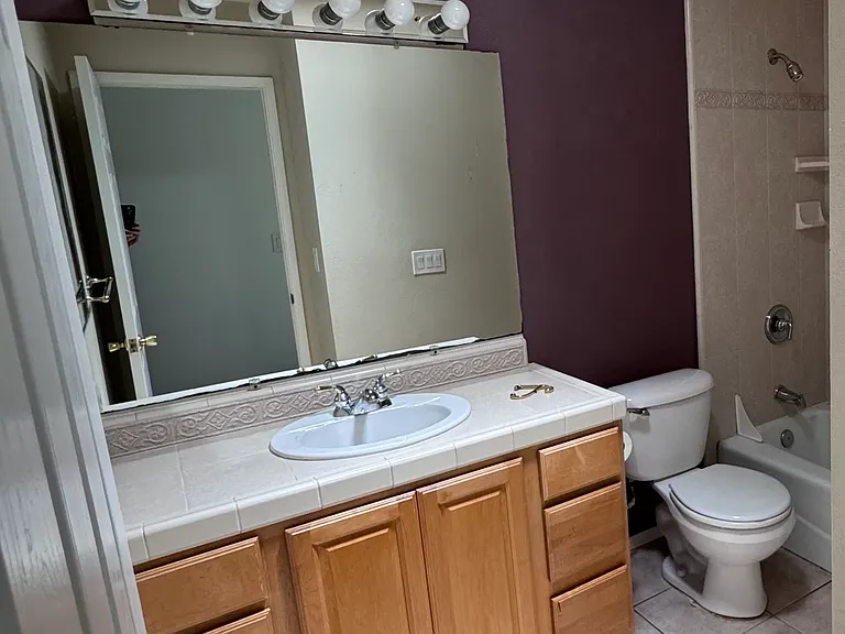 Hallway bathroom with full bath, solar tube adds lots of natural light. Ceiling heater.