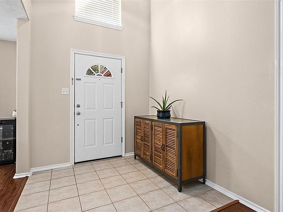 Bright, welcoming entrance with high ceilings.