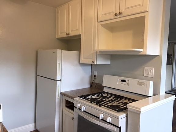 Kitchen with refrigerator and stove