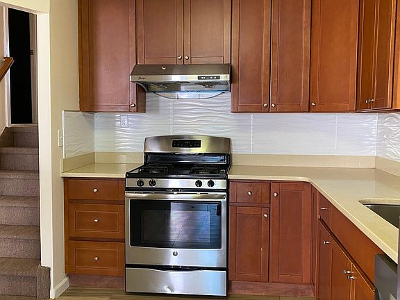 Kitchen and its appliances. 6 steps lead to the bedrooms and bathrooms