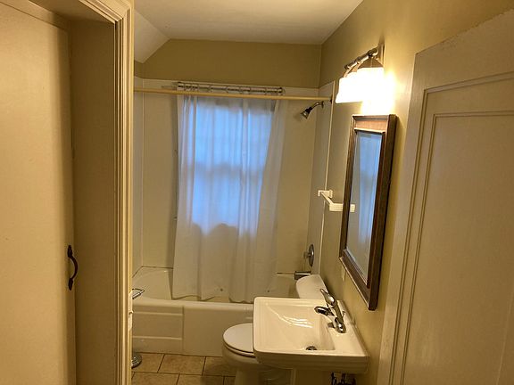 Bath with linen closet and drawers for storage.