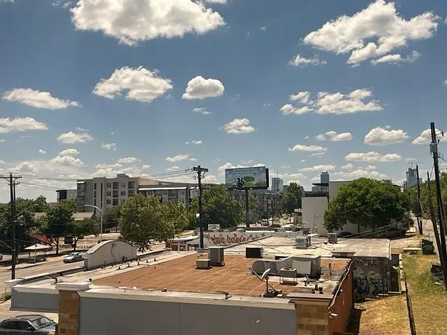 Unit faces west towards downtown, sunsets every day (from living room window)