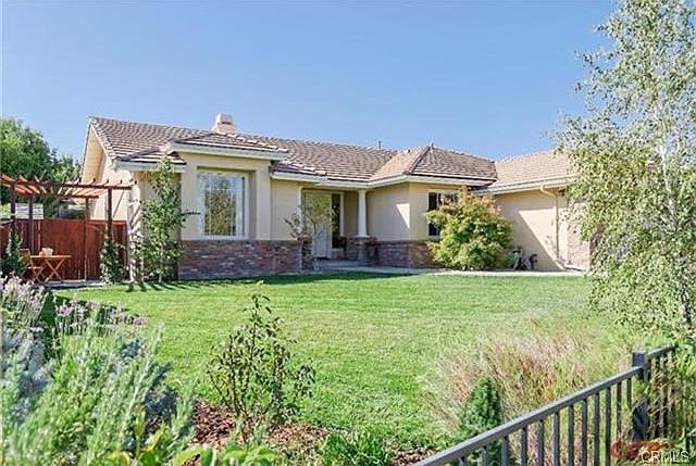 Fenced Front Yard with sitting area