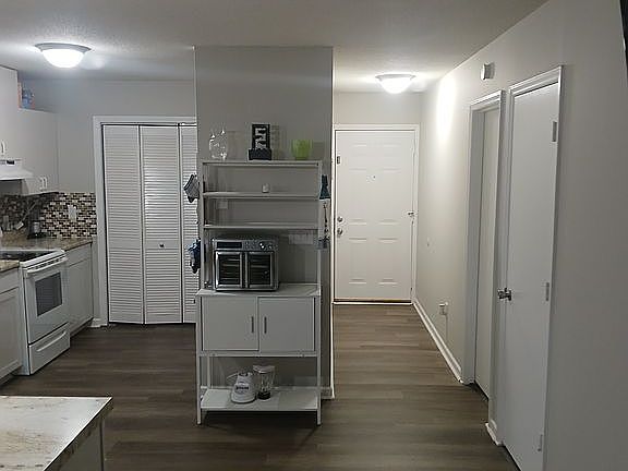 Unit 1 kitchen and halm way door