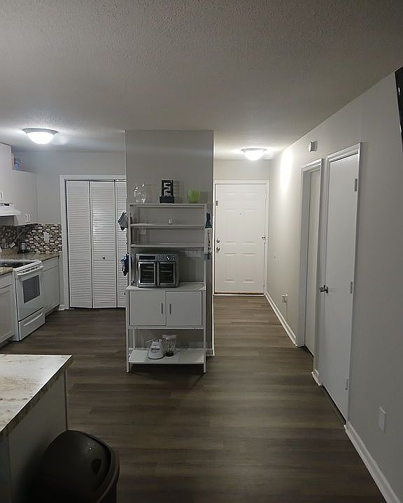 Unit 1 kitchen and halm way door
