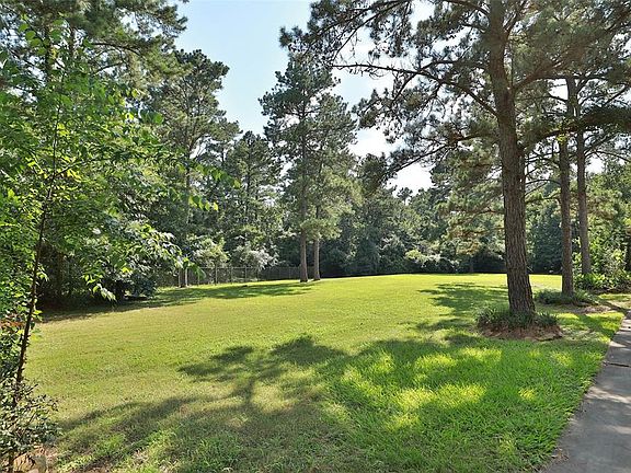 This lot is nearly an acre and has so much potential! Enjoy the privacy and let the kids play! Home has never flooded per the owner.