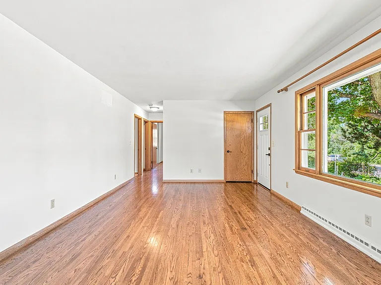 Large Living Room with abundant windows and tranquil sunset views over Lake St. Joe! (19 x 12)