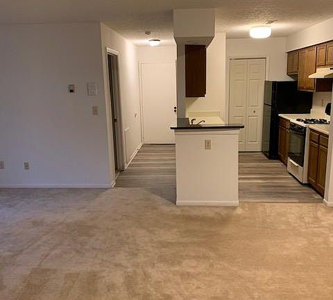 In living room looking to entry and kitchen