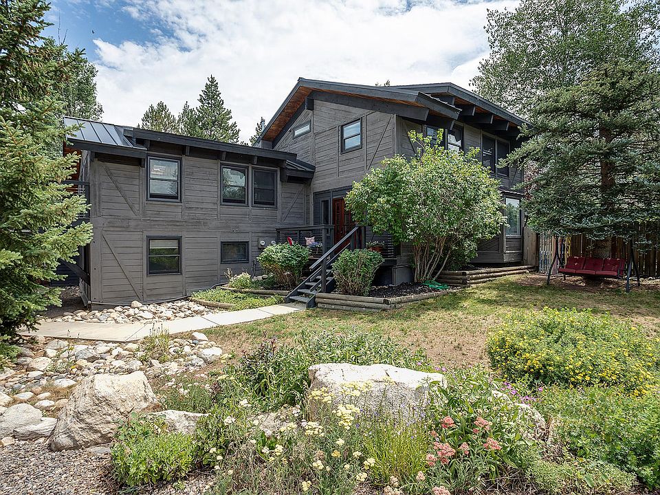 Exterior of house, with mature landscaping and gardens