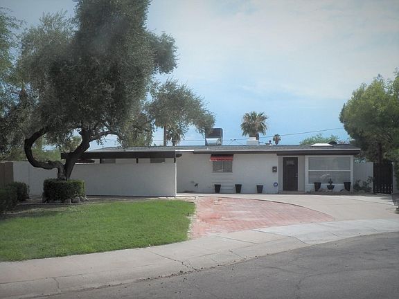 Front Exterior - Carport at left