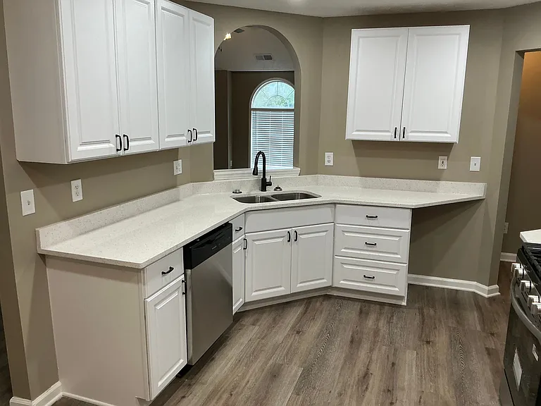 White cabinetry and quartz countertops