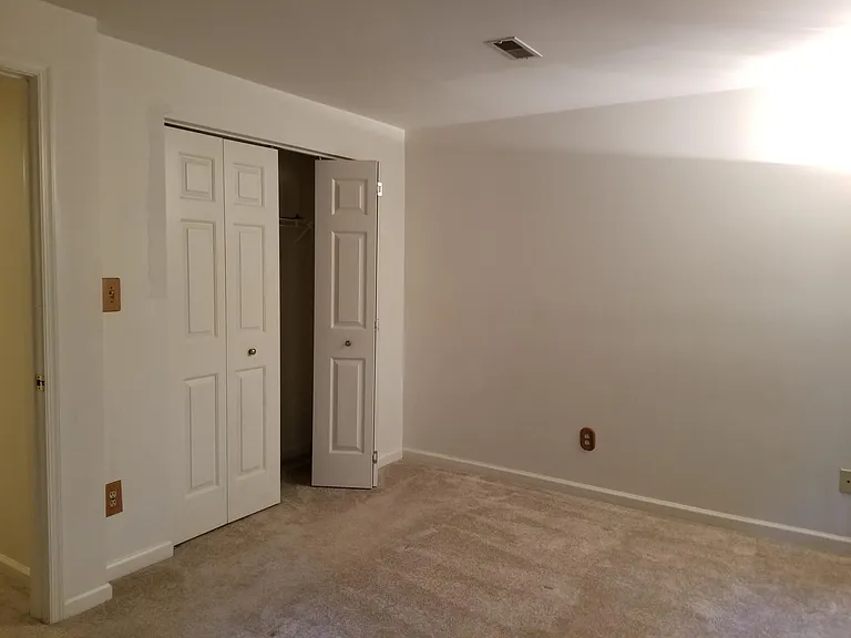 Ofice or guest room in basement. Door leads to backyard.