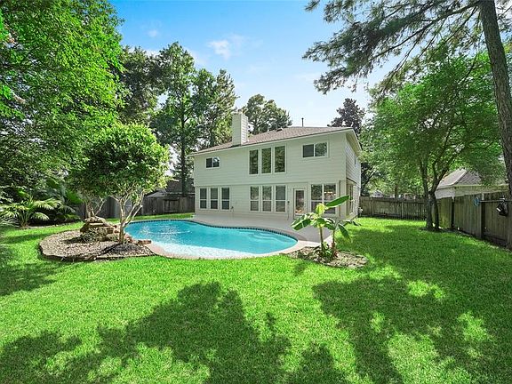 Another view of the backyard and pool with plenty of room to play.