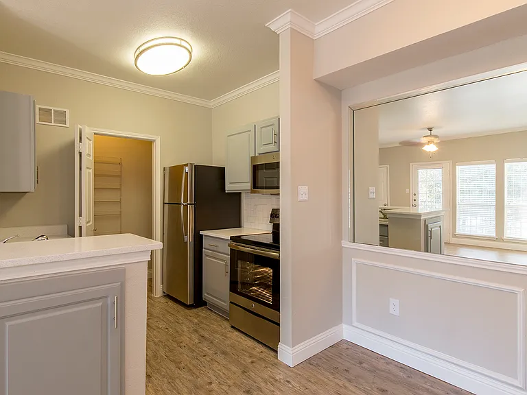 Open-concept kitchen and living area with breakfast bar