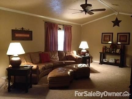 Living Room
						:
						Large living room with fireplace and crown molding