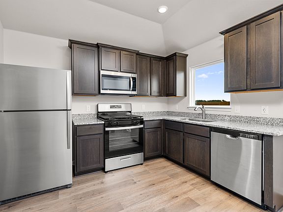 The kitchen has stainless-steel appliances.
