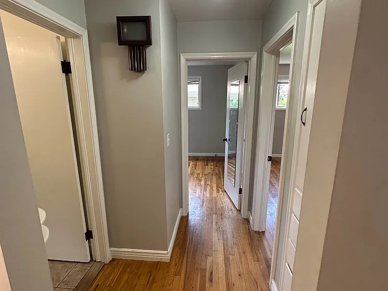 Hallway to upstairs bedrooms and bathroom