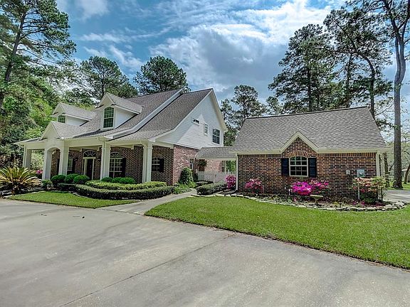 There are two gates to enter the property and long circular driveway with a three car garage. The exterior was painted 4/2017 and the roof has a 40 year shingle.