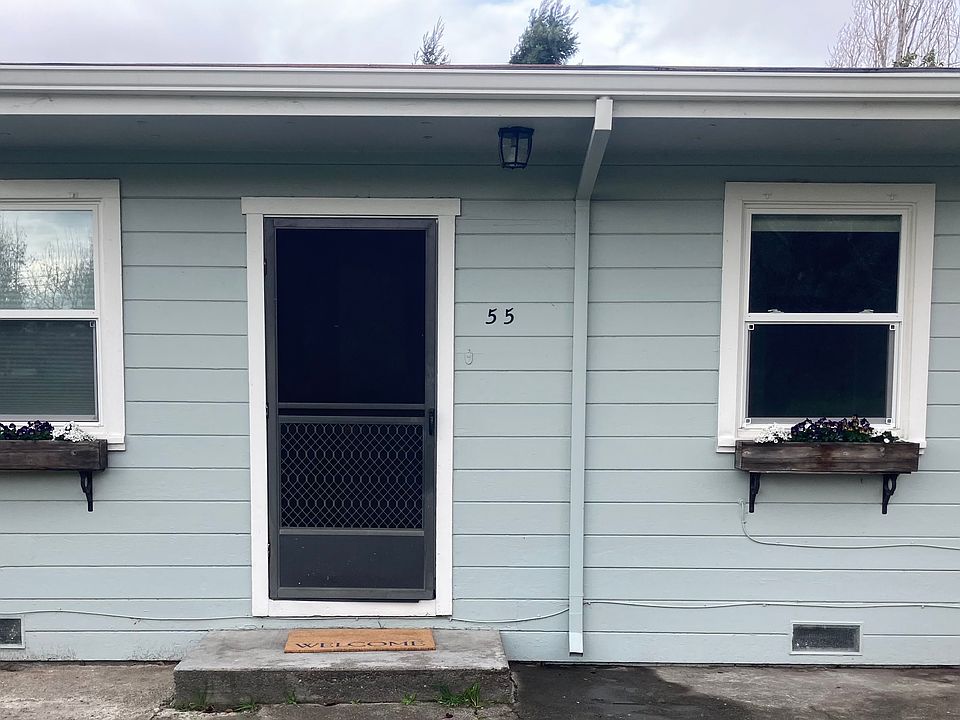 front of house - left window is in the living room, right window is in the front bedroom