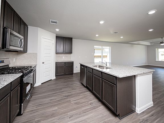Kitchen to Dining Area and Family Room