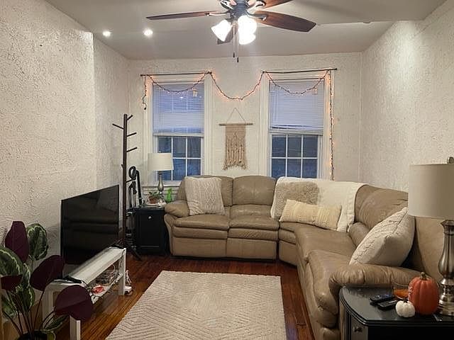 Enter 2nd Floor apartment into Spacious & Naturally Bright LivingRoom with Ceiling Fan & Light & Refinished Original Wood Floor