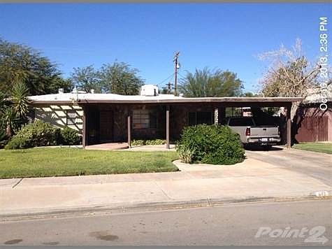 Well kept yard. Covered Carport.