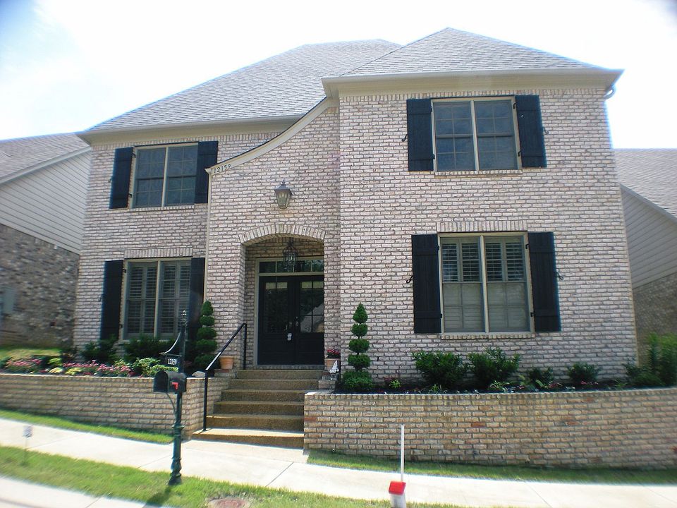 Wonderful brick french traditional zero lot line home.  See the 3 car garage