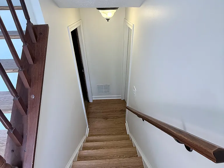 heading downstairs. To the right is the finished space, and to the left is the unfinished space.