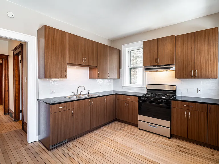 kitchen + hallway leading to rest of apartment
