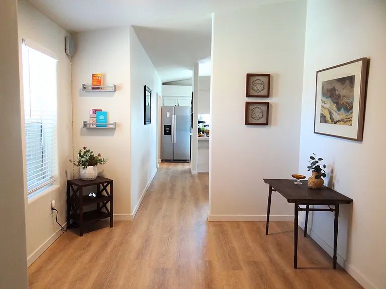 Bright and spacious entryway with natural light, warm tones, and inviting decor_perfect for welcoming you home!