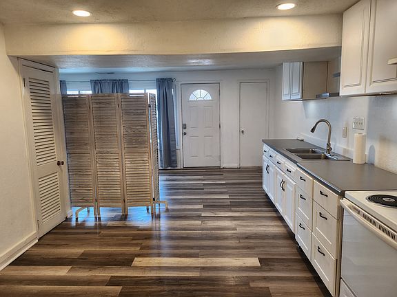 With movable room divider.
