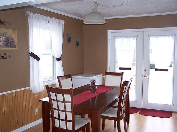 Large country kitchen offers a large dining area.