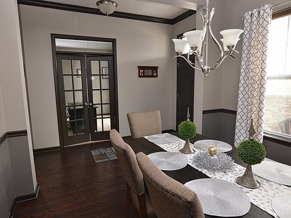 Entire first floor has 11' ceilings. Neutral decor and fresh paint (2016). Brushed nickel hardware and light fixtures. Entry crown molding, dining room crown molding and chair rail.